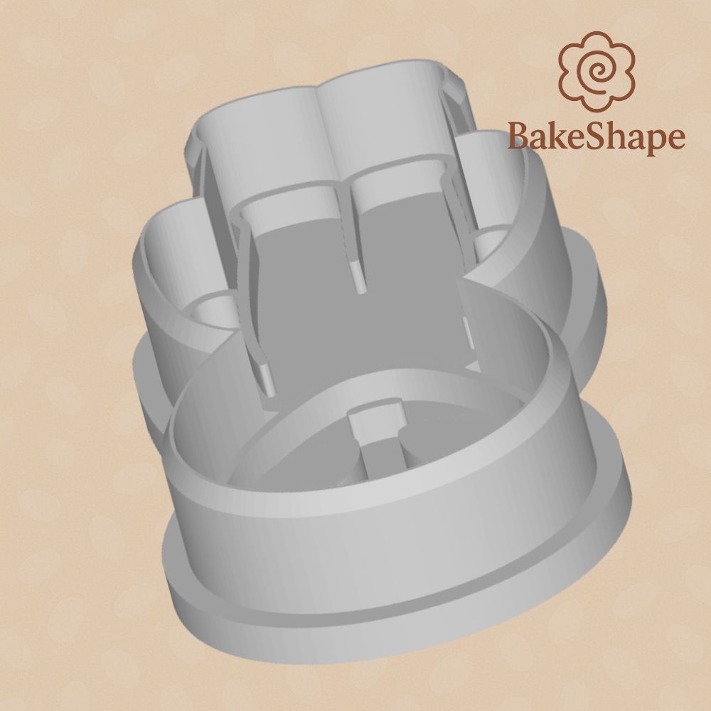 Side perspective of alien cookie cutter showing layered embosser lines