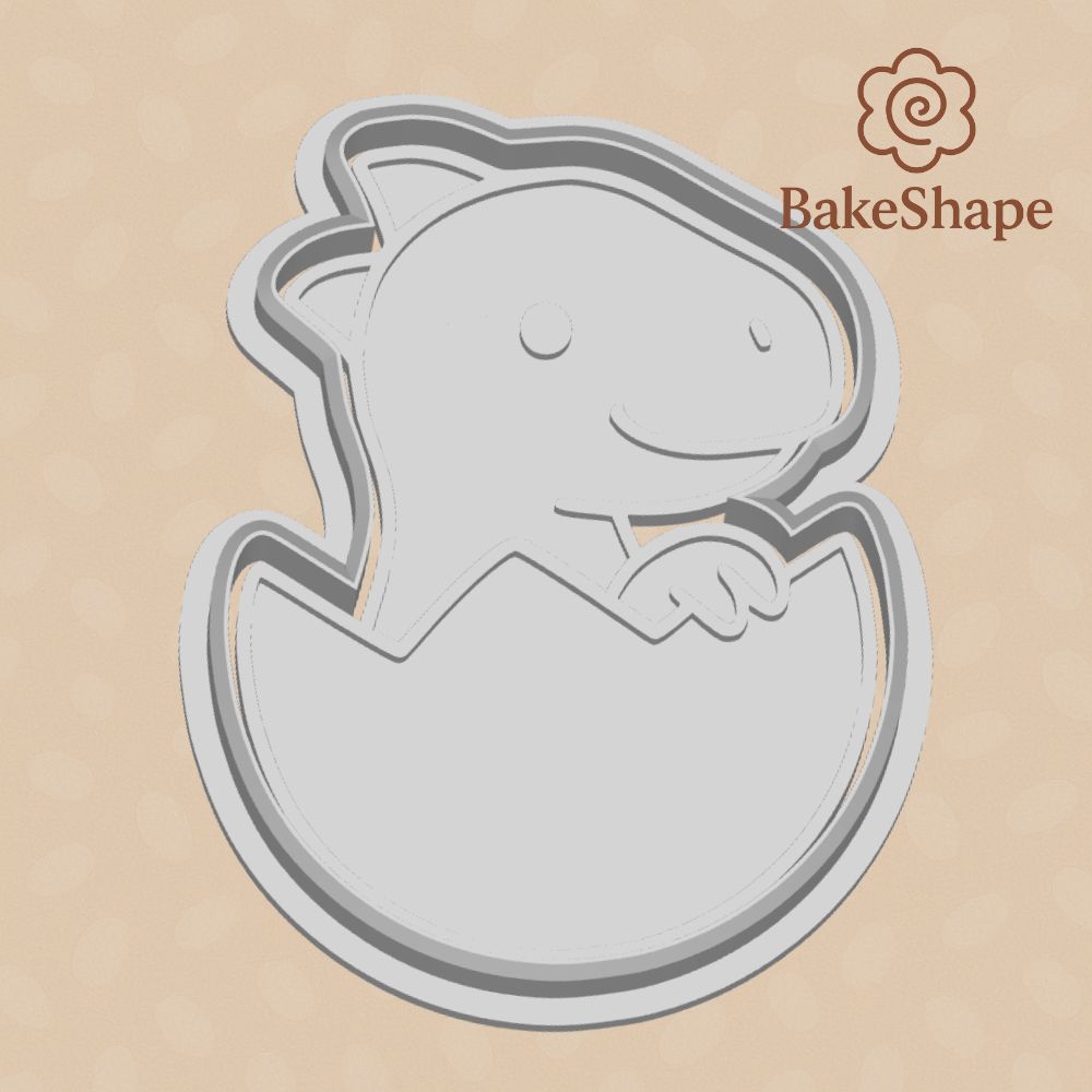 3D printable baby dino in egg cookie cutter STL file with smiling face and cracked shell